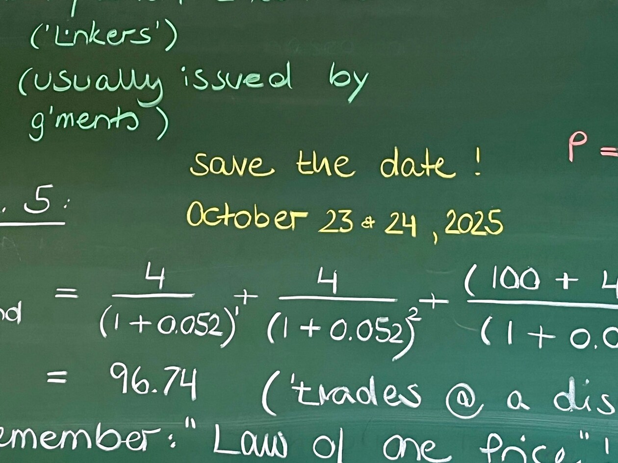 Save the Date announcement for October 23 & 24, 2025, on a chalkboard with financial formulas. Chalkboard with financial formulas and a 'Save the Date' note for October 23 & 24, 2025, written in yellow chalk.