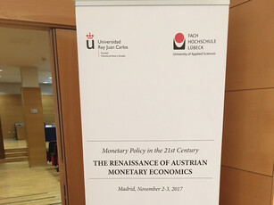A roll-up banner for a conference on monetary policy in Madrid, November 2017.