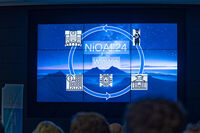 Präsentationsfolie mit "NiQAI '24" und Win-Win-Konzept, gezeigt bei der Night of AI 2024 an der Technischen Hochschule Lübeck.