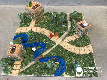 Lebkuchenhaus Cohabitation in Miniatur Eine grüße landschaft mit blauem fluss aus süßigkeiten