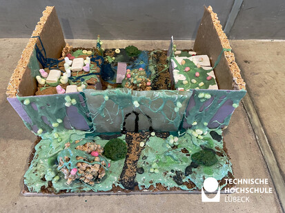 Lebkuchenhaus Rebellion der Flora florales arrangement von süßigkeiten zu einer landschaft